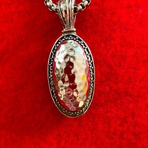 Women’s Silver hammered pendant.